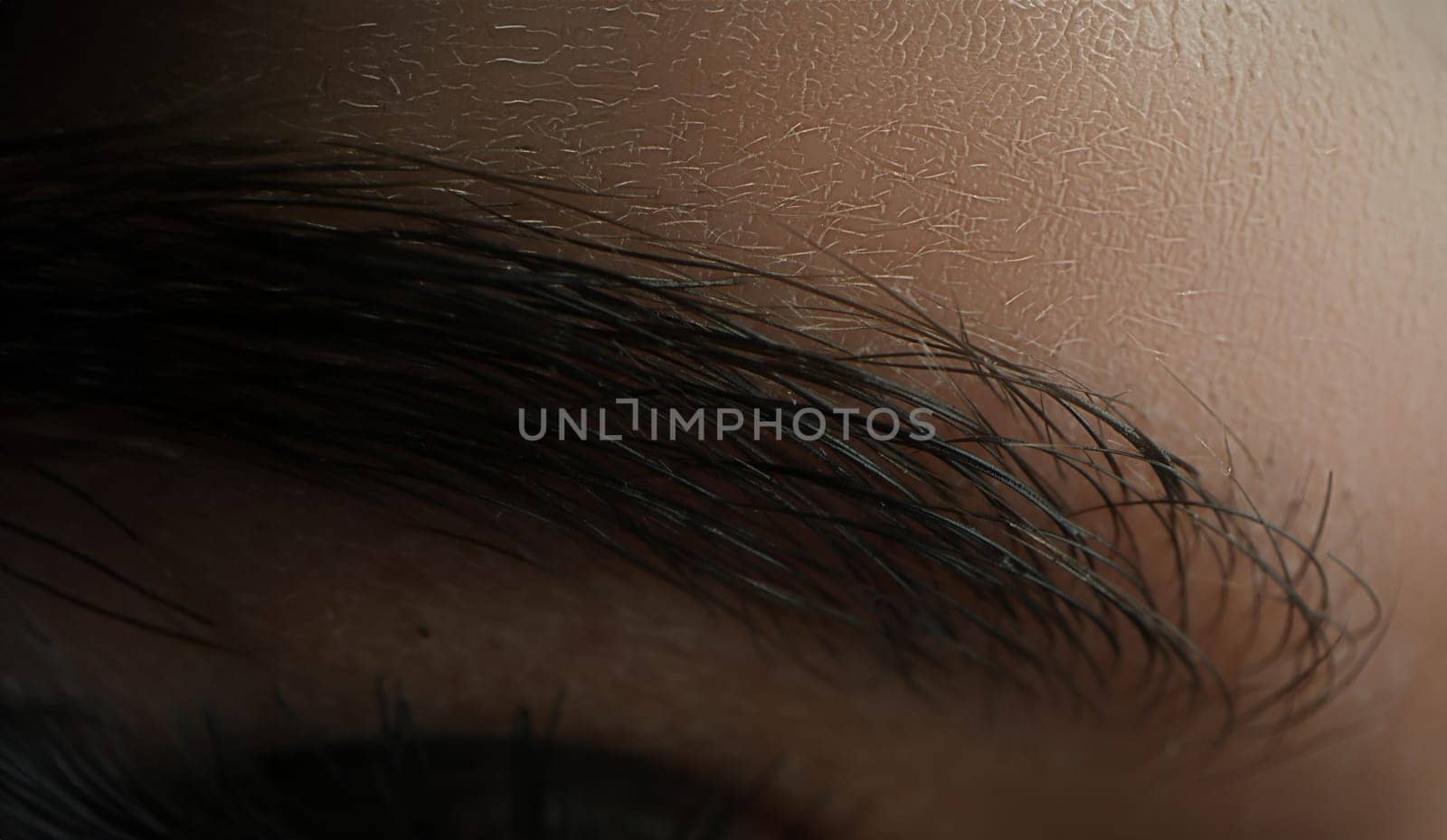 Female eyebrow dyed with black henna closeup by kuprevich