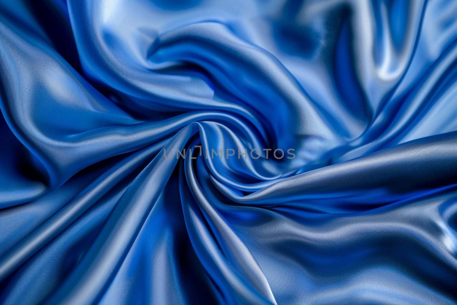 Close-up of elegant blue silk fabric texture with luxurious abstract folds and soft, shiny surface for backgrounds or design