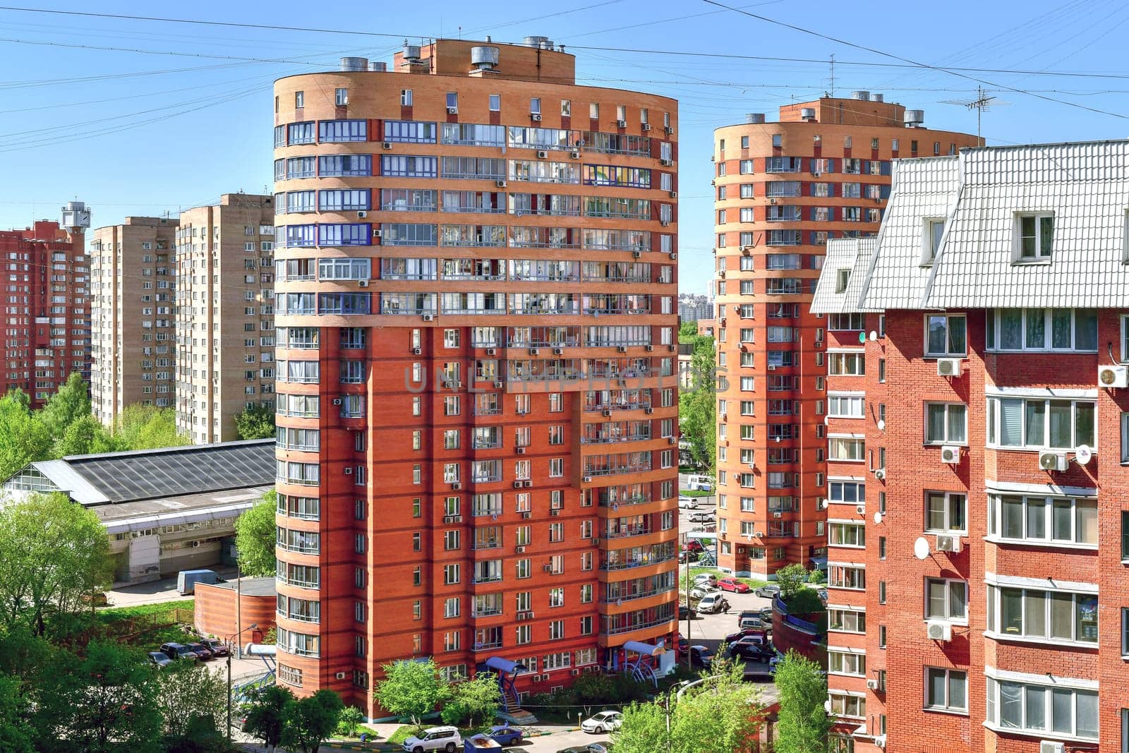 Khimki, Russia - May 10. 2018. Cityscape with the residential buildings, cars and road