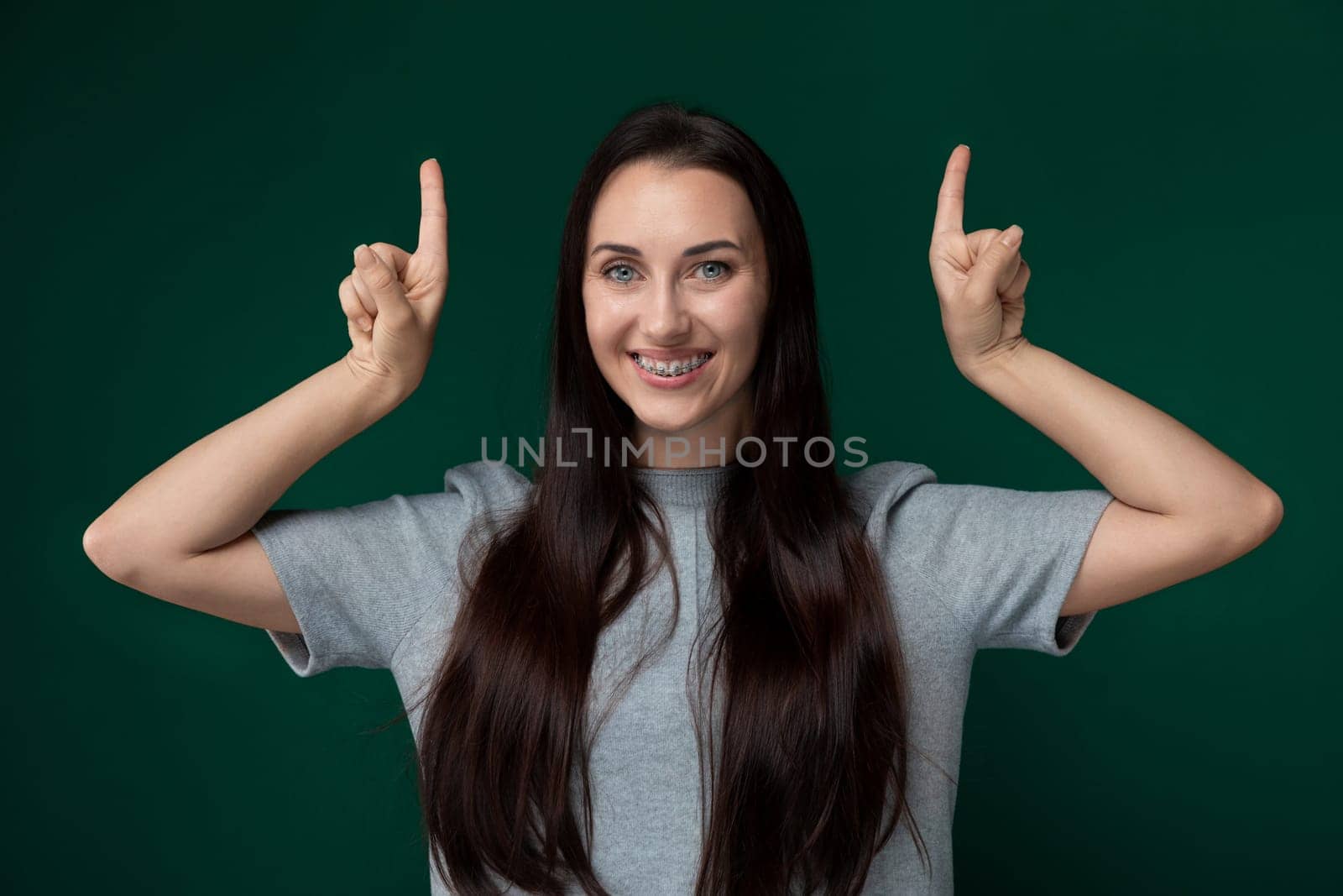 Woman With Long Hair Making a Peace Sign by TRMK