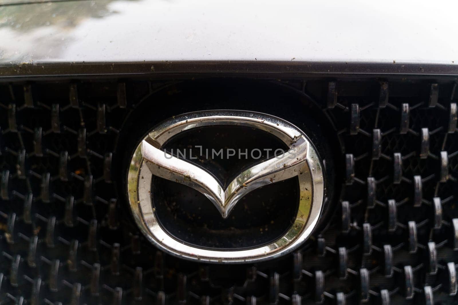 Bobruisk, Belarus - September 24, 2023: Automobile company logo - Mazda on a car.