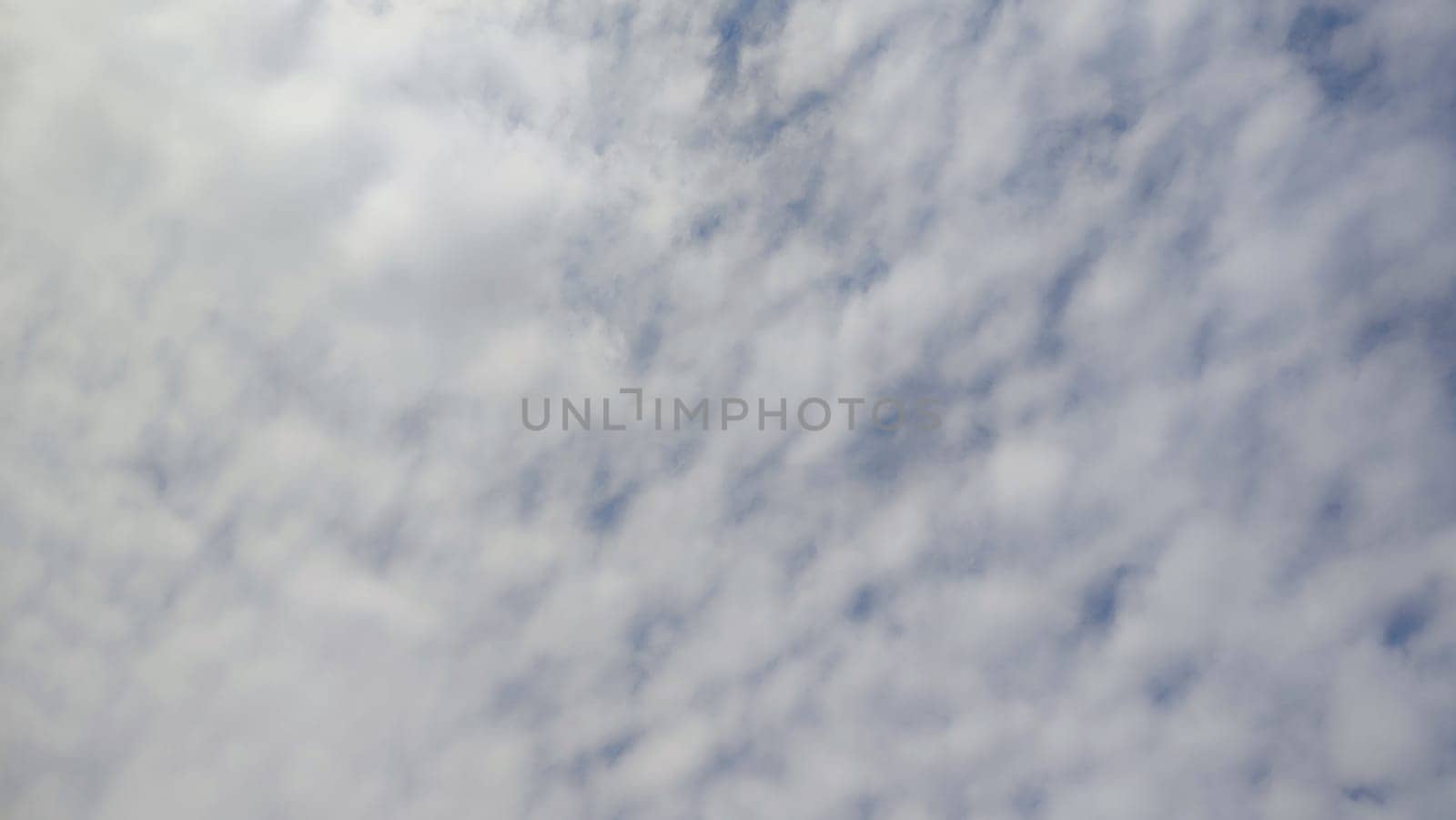 Blue gray light sky nature white clouds whether background, sun face . High quality photo