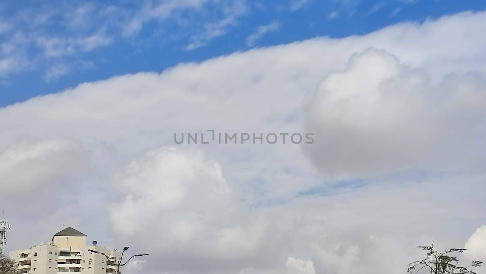 Blue gray light sky nature white clouds whether background, sun face . High quality photo