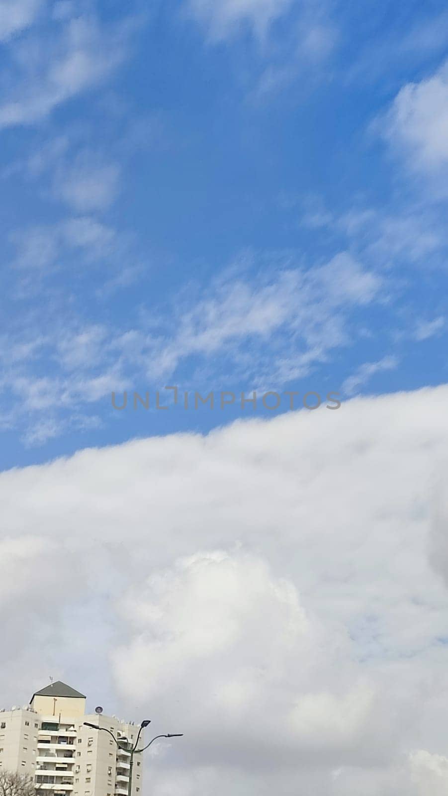 Blue gray light sky nature white clouds whether background, sun face . High quality photo