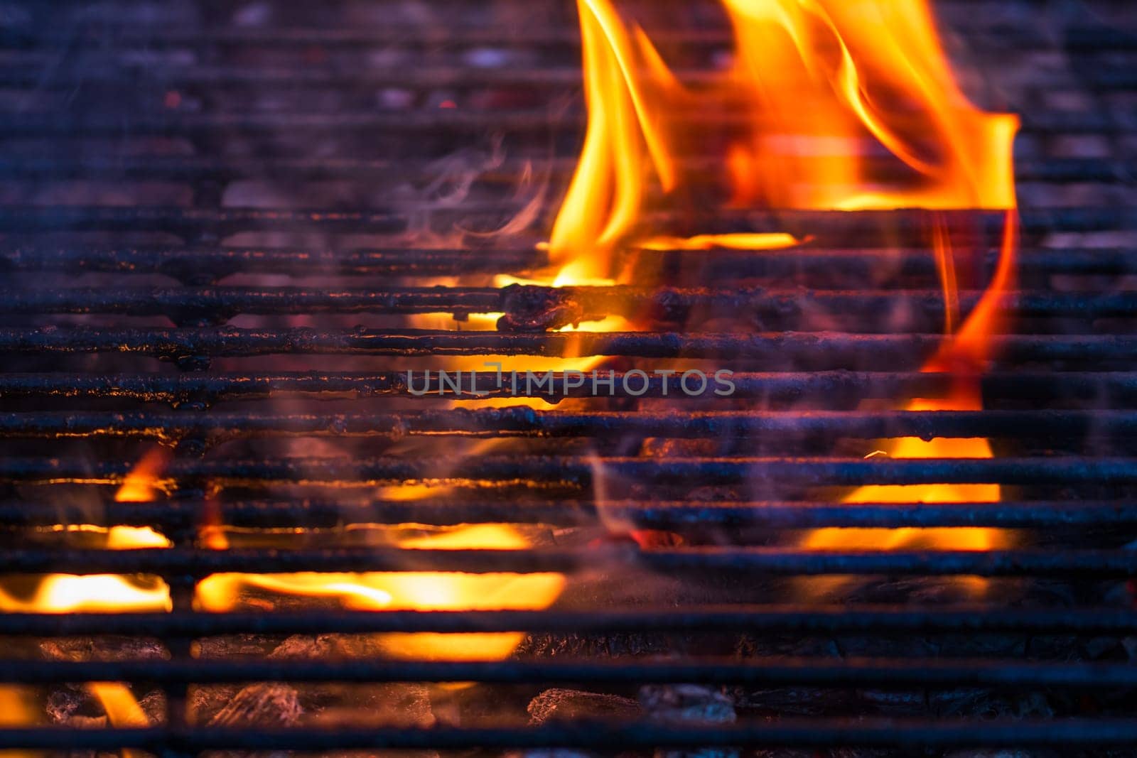 Empty hot charcoal barbecue grill with bright flame by vladispas