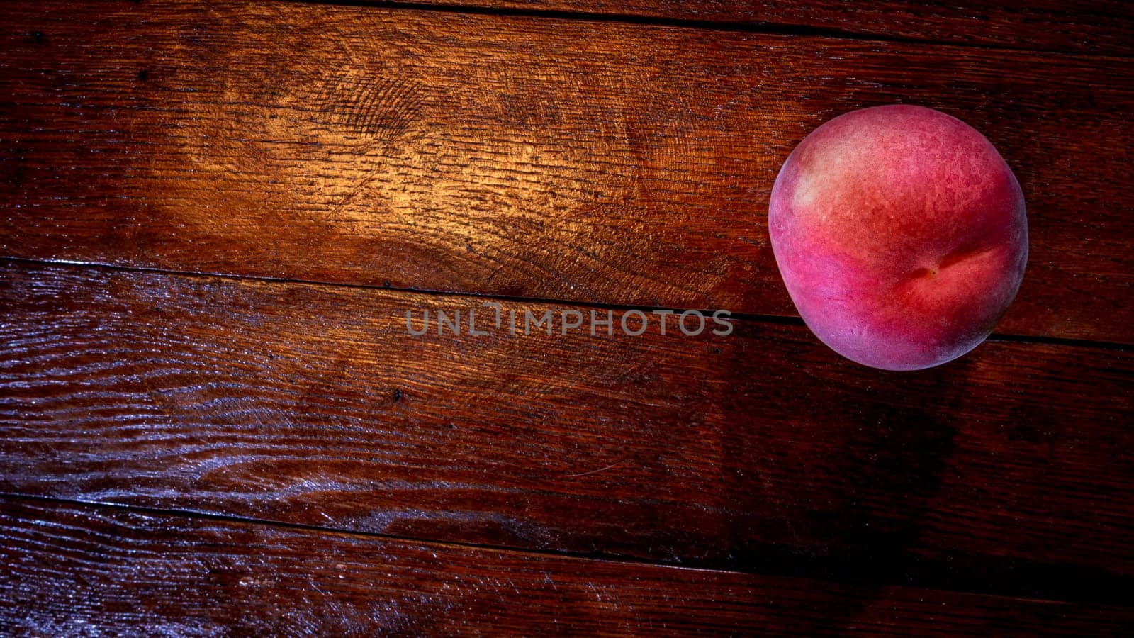 Fresh juicy peaches on rustic wooden table by vladispas