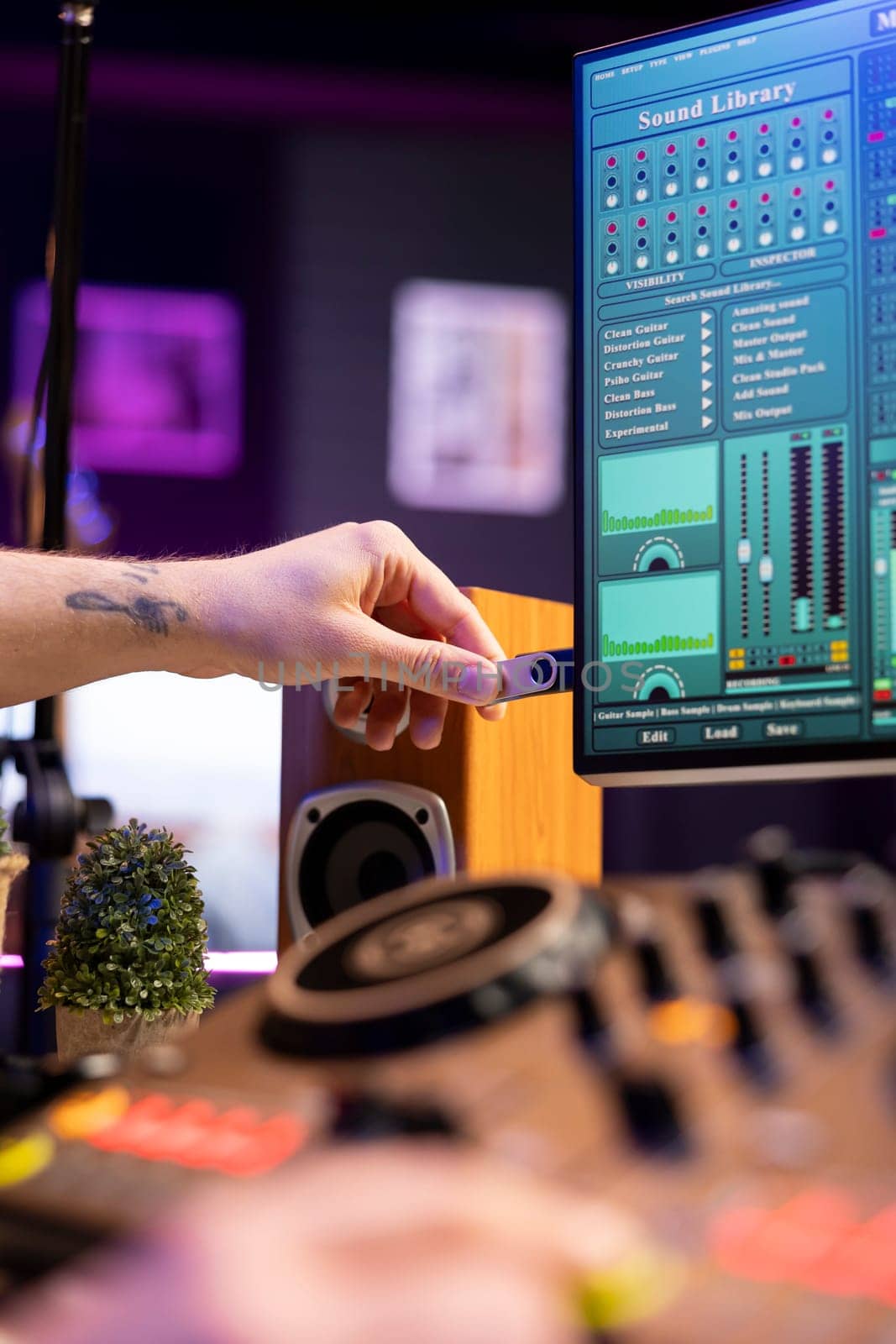 Talented producer using an usb stick to edit recorded audio files by DCStudio