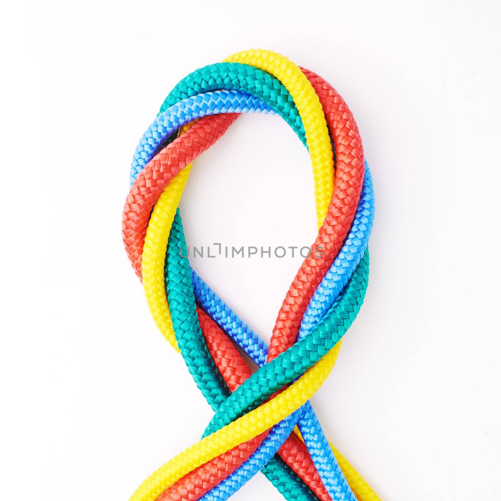 Colorful, ropes and tied for together in studio to represent unity, connect and trust. Secure, string and reef knotted for security to stop movement of objects safety on isolated white background.