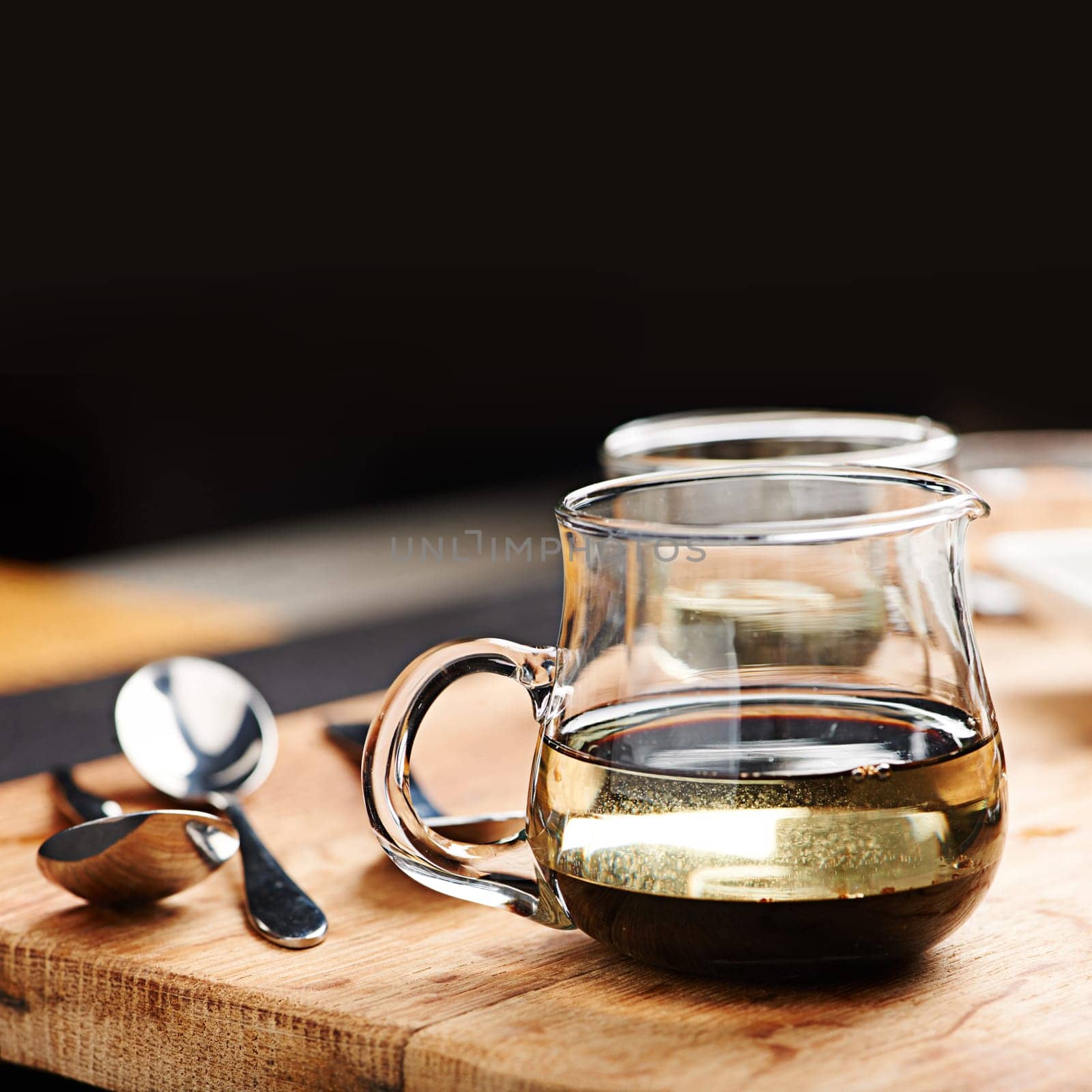 Balsamic, vinegar and olive oil in pitcher on table for marinade as liquid dressing in glass for taste on countertop. Natural, nutrition and health for antioxidants, inflammatory and help blood flow.