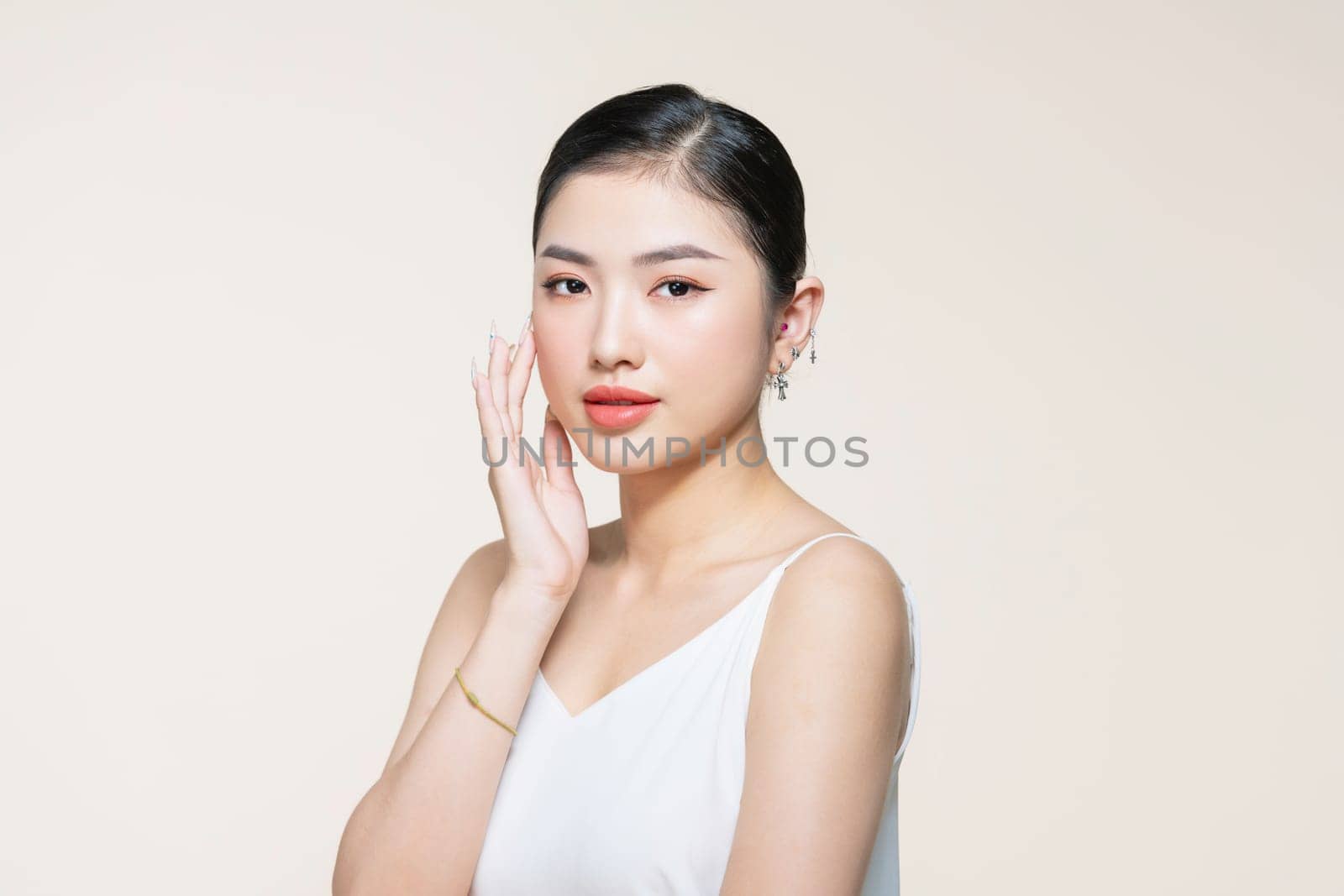 Skin care.Woman with beauty face touching healthy facial skin portrait.Asian woman.