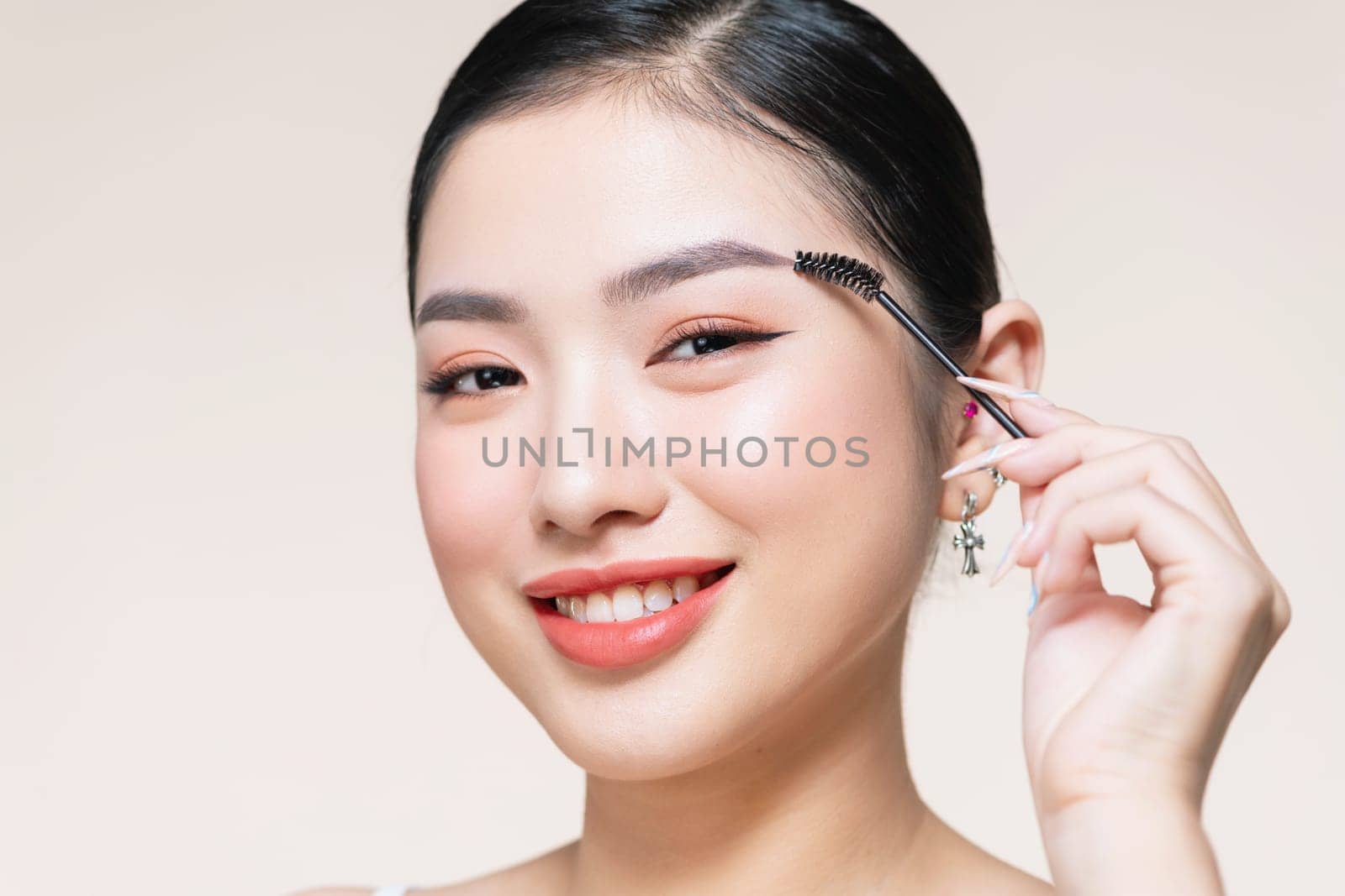 Girl makes makeup. Beautiful woman apply mascara on eyelashes with cosmetic brush