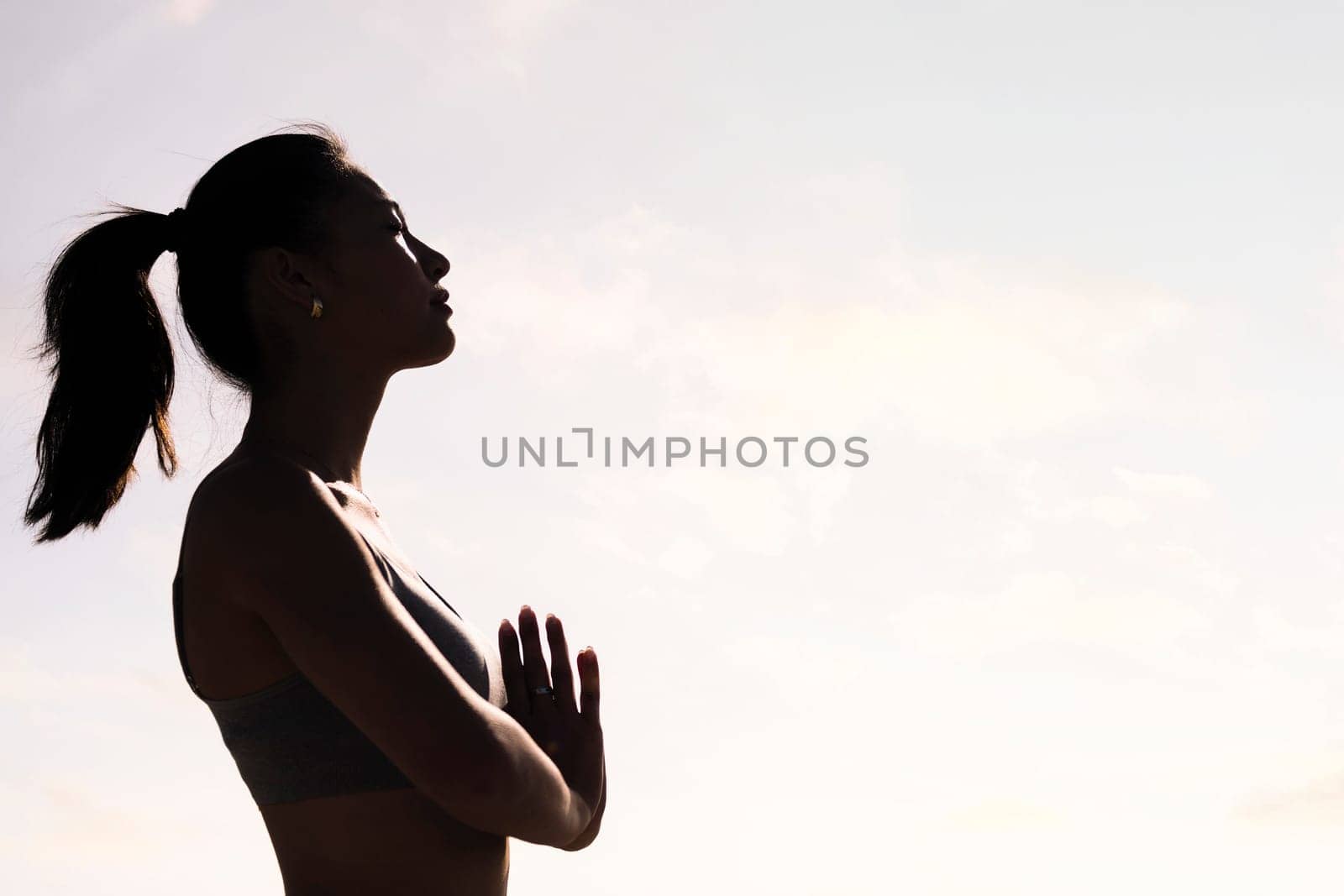 woman practicing yoga in pray position by raulmelldo