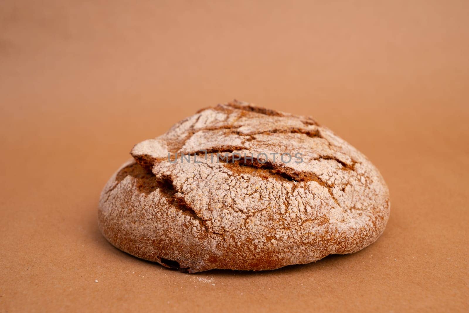 freshly baked bread on Brown craft paper by zartarn