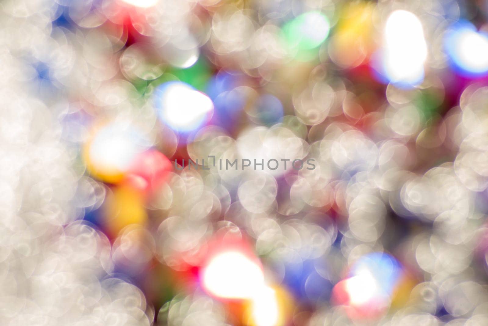 Abstract glitter color lights chrismas background. de-focused by zartarn