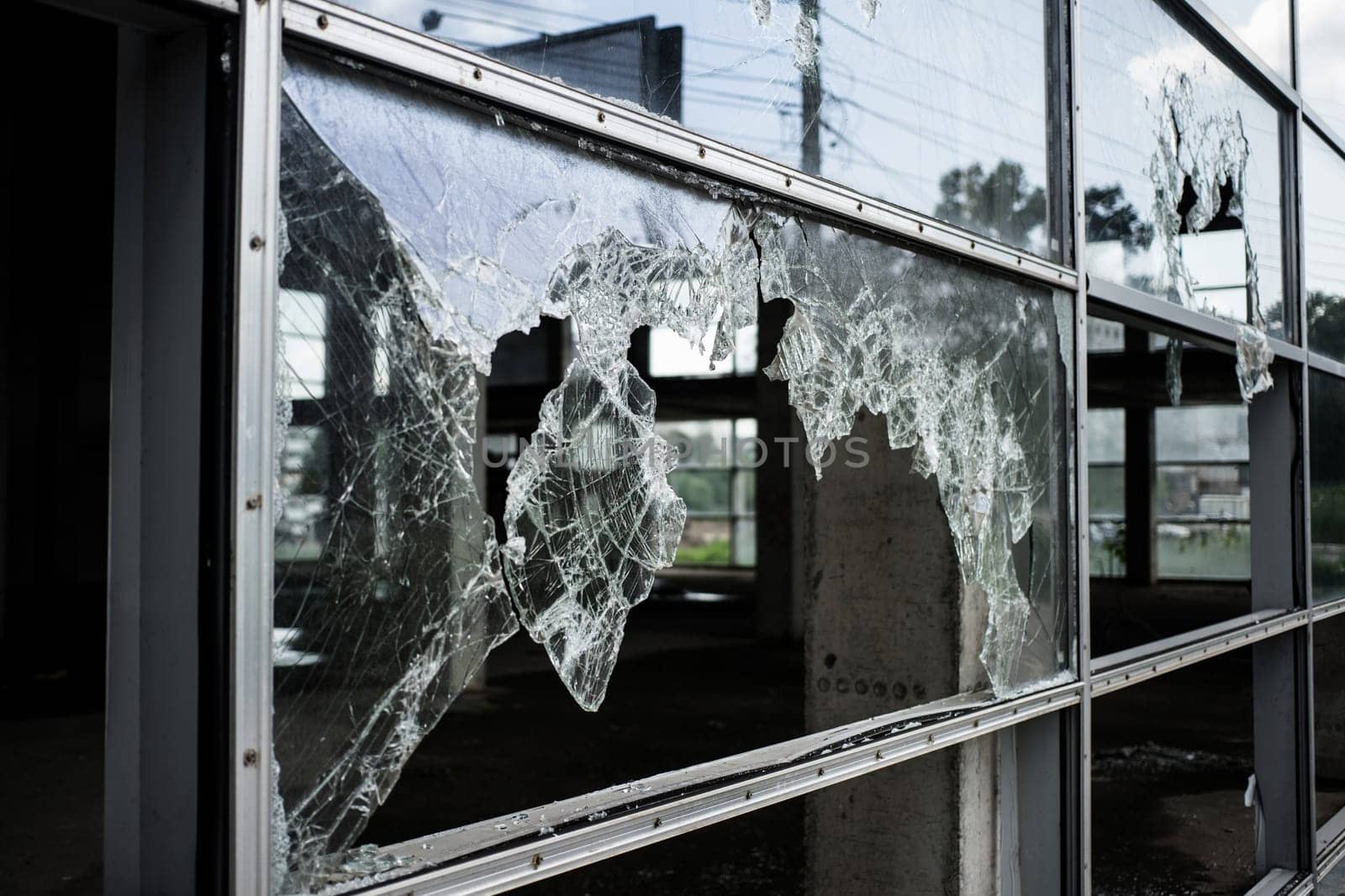 Accident cracked damaged broken shopping mall window glass.