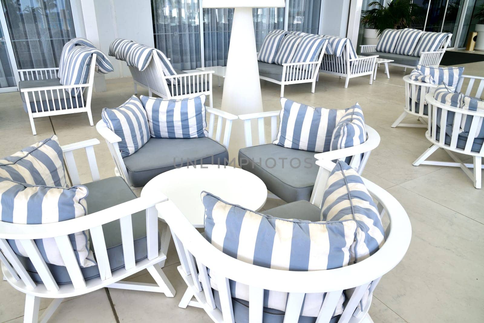 lounge with striped sofas and tables