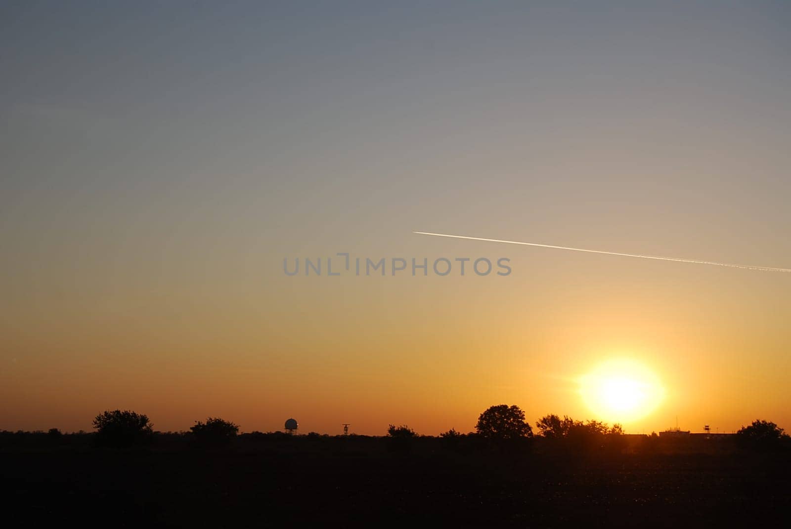 Sky, sun, evening and air plane with contrail.