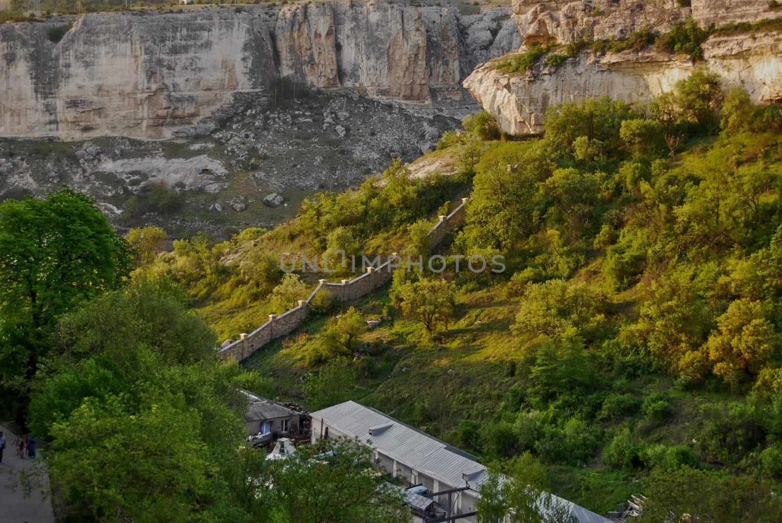 On the left in the corner you see a tourist route, and at the foot of the mountain there is a private houses.