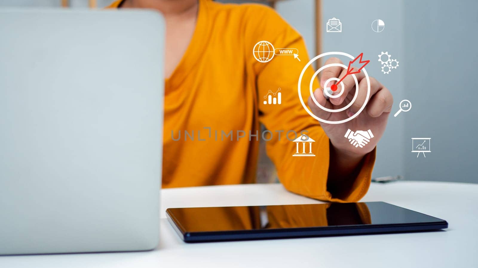 Business woman pointing to the target, Business concept, management concept business planning concept, Targeting the business concept, Business development concept, Analyzing sales data.