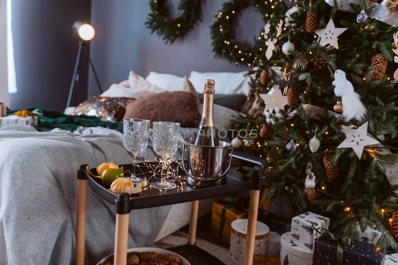 A tray with a bottle of champagne, two wine glasses, and fruit. Scene is celebratory and festive. by Matiunina