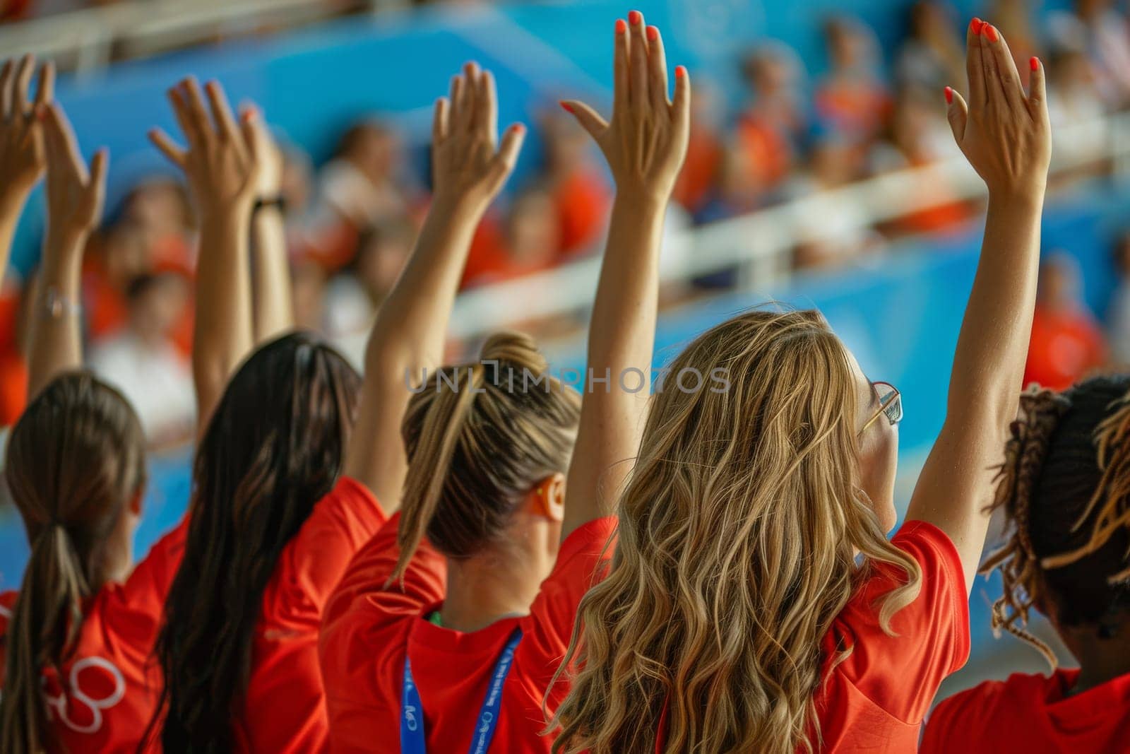 A group of sport fans cheering a sport match.
