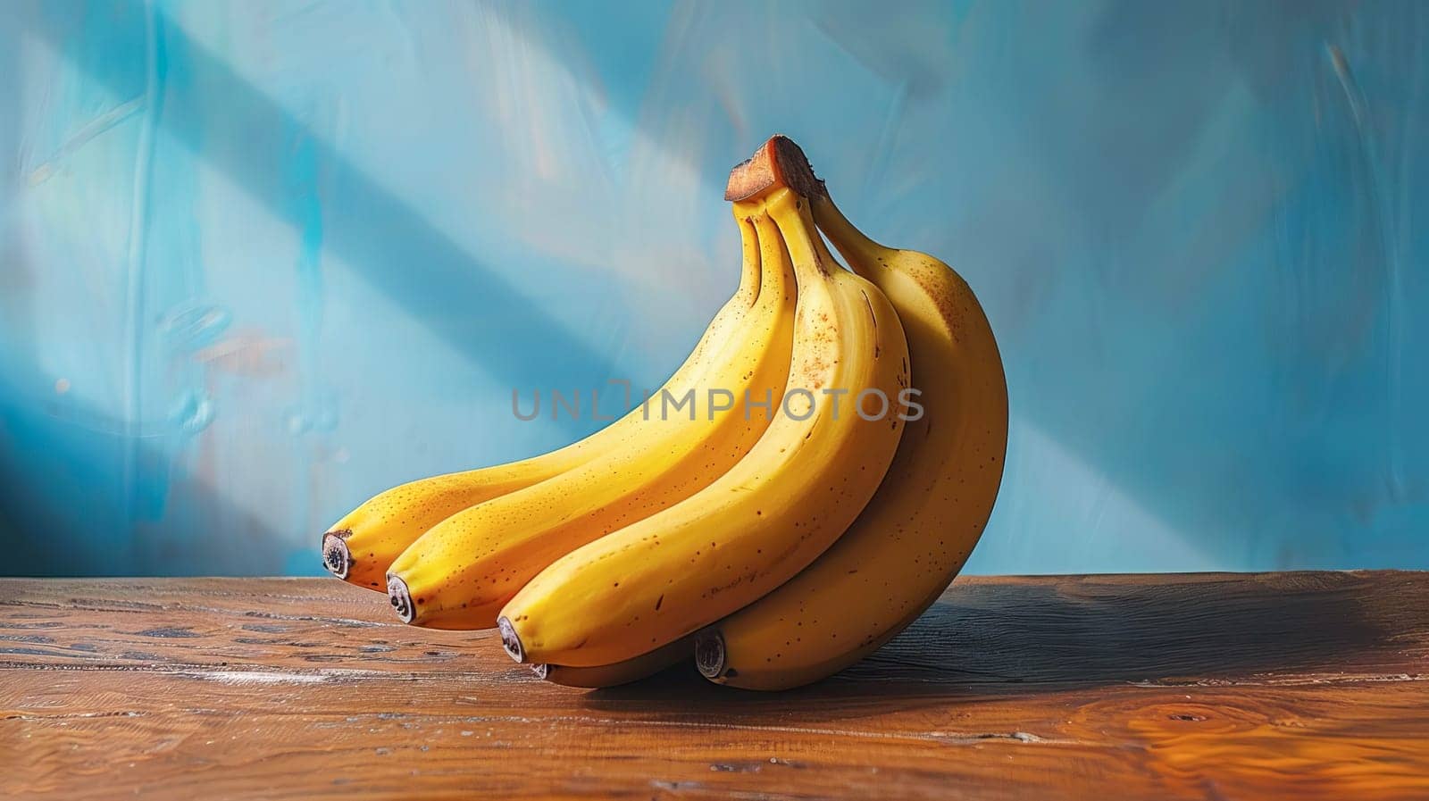 Ripe fresh bananas on a wooden surface.