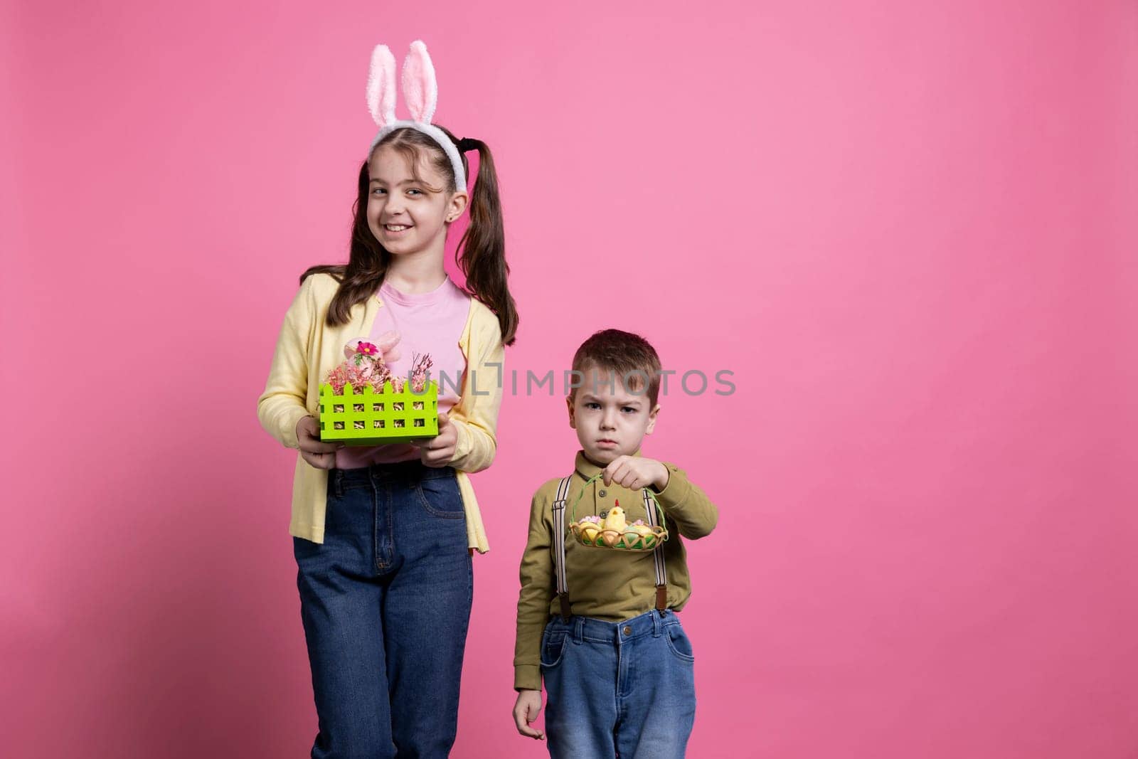 Young kids holding handmade decorations and ornaments on camera by DCStudio