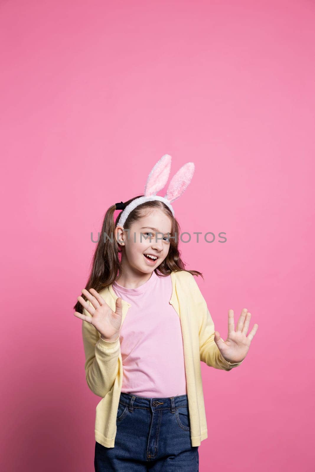 Little child acting excited and cheerful about easter festivity by DCStudio