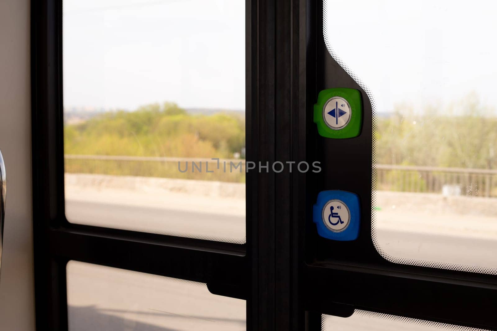Doors of public transport with buttons for manual opening and calling for help when exiting for disabled people, modern technologies in transport