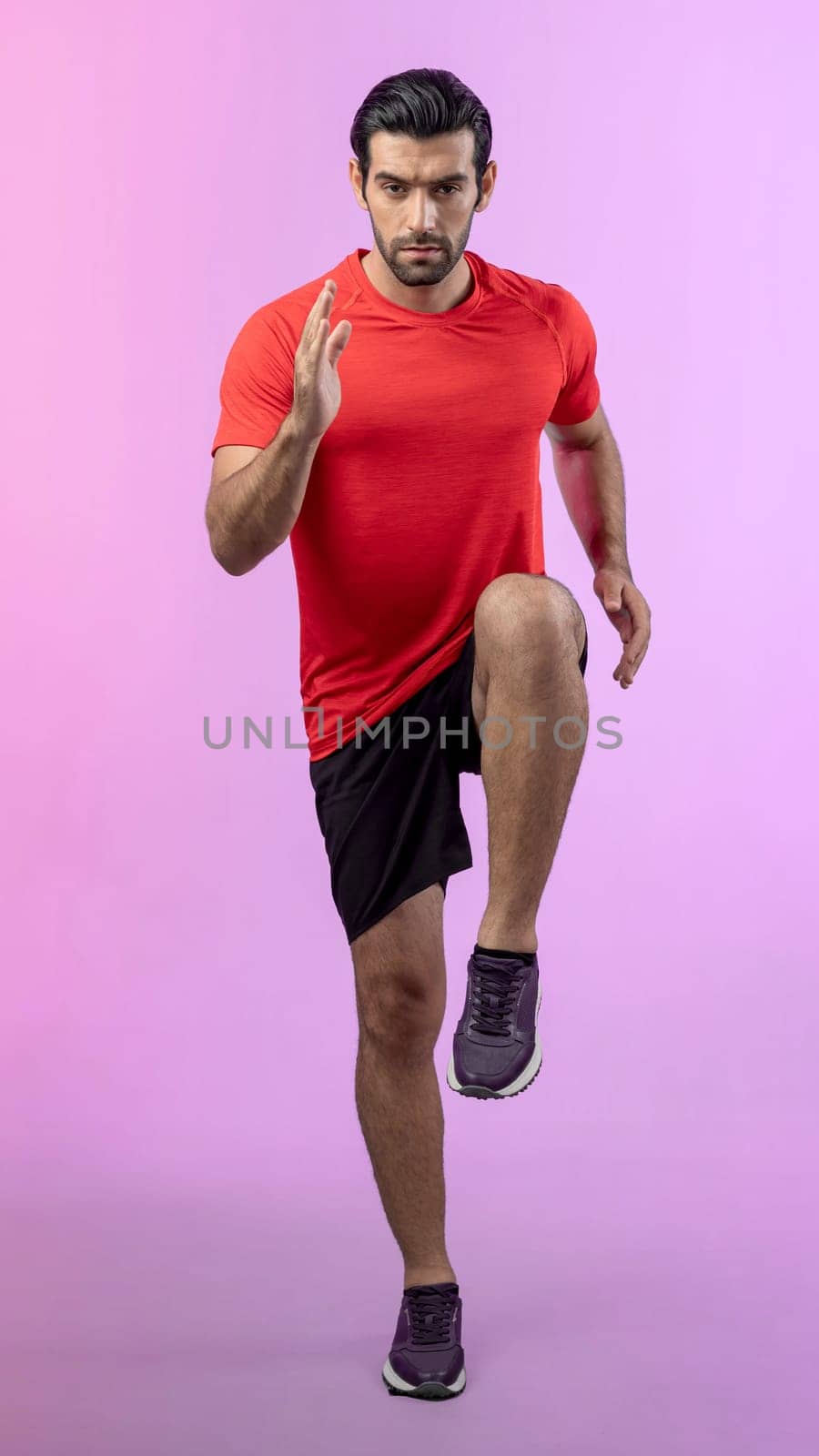 Full body length gaiety shot athletic and sporty young man fitness running cardio exercise posture on isolated background. Healthy active and body care lifestyle.