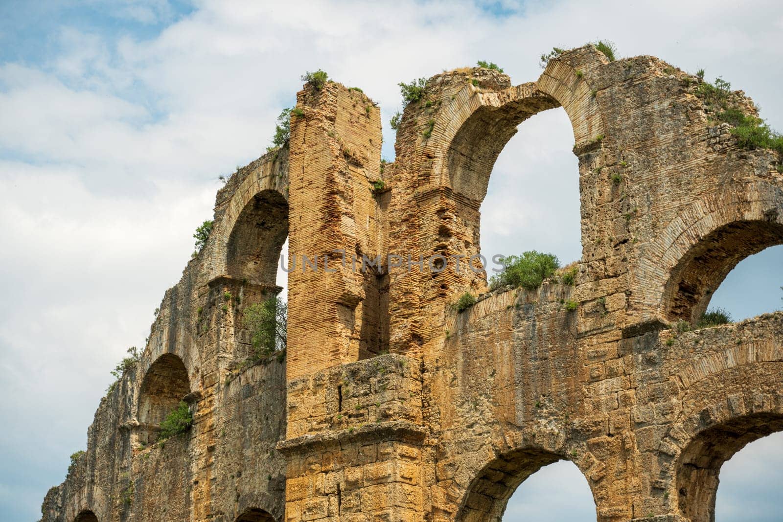 Aqueducts in the ancient city of Aspendos in Antalya, Turkey by Sonat