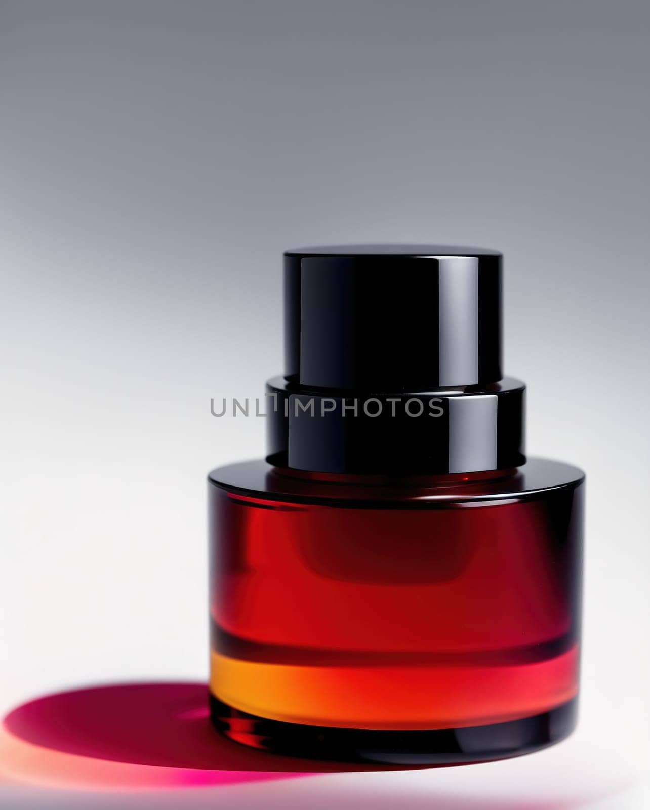 The image is a black and white photograph of a glass vial filled with a red liquid, with a small amount of the liquid spilled onto the top of the vial.