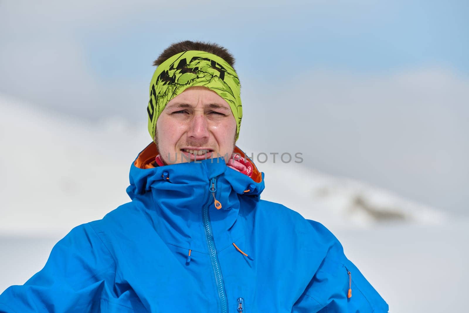 Portrait of a Professional Skier's Blissful Relaxation atop the Snowy Alps by dotshock
