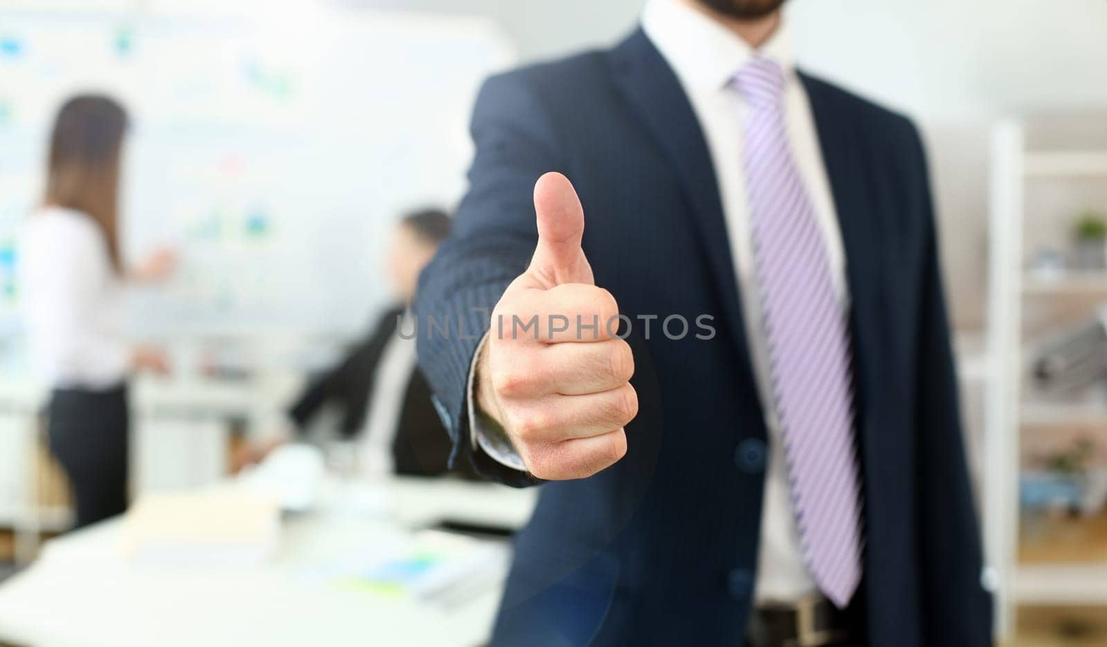 Male arm show OK or confirm during conference in office closeup. High level and quality product offer okay symbol expression perfect mediation solution happy client creative adviser colleague