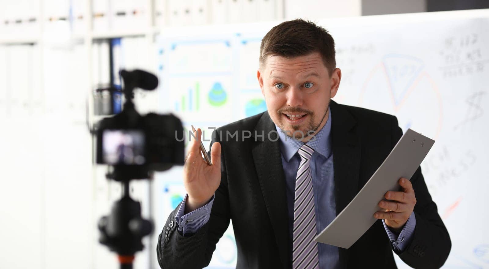 Businessman blogger online coach screaming intro camera concept