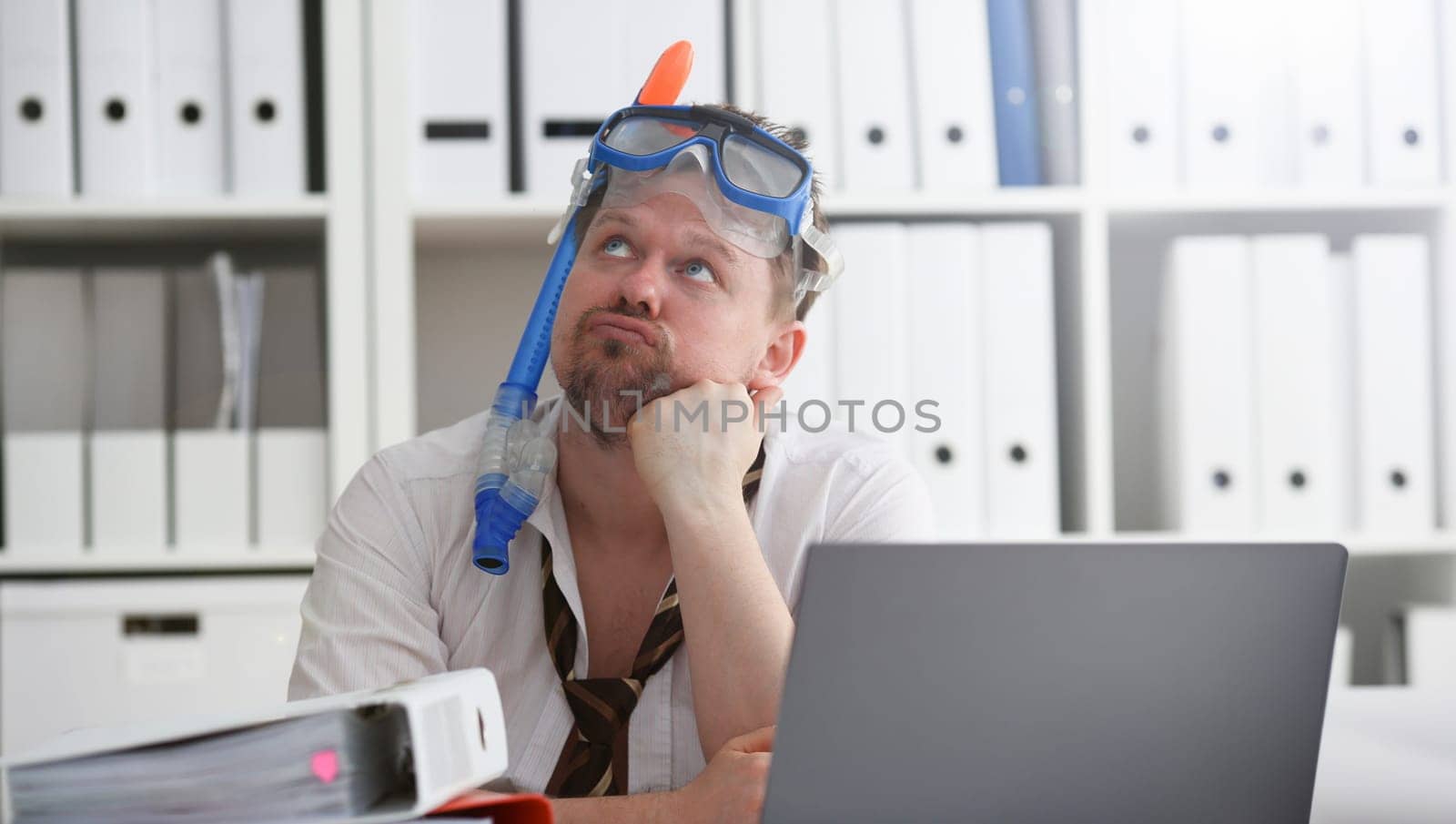Man wearing suit and tie in goggles with snorkel by kuprevich