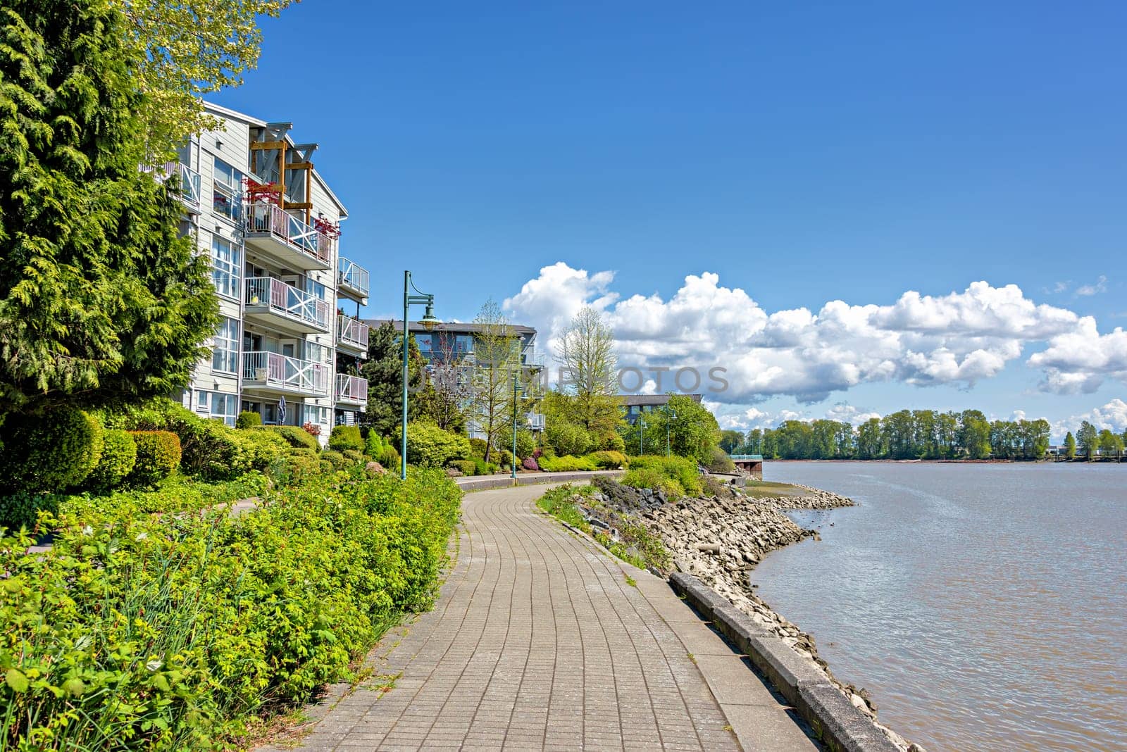 Waterfront walkway along the bank of Fraser river in New Westminster by Imagenet