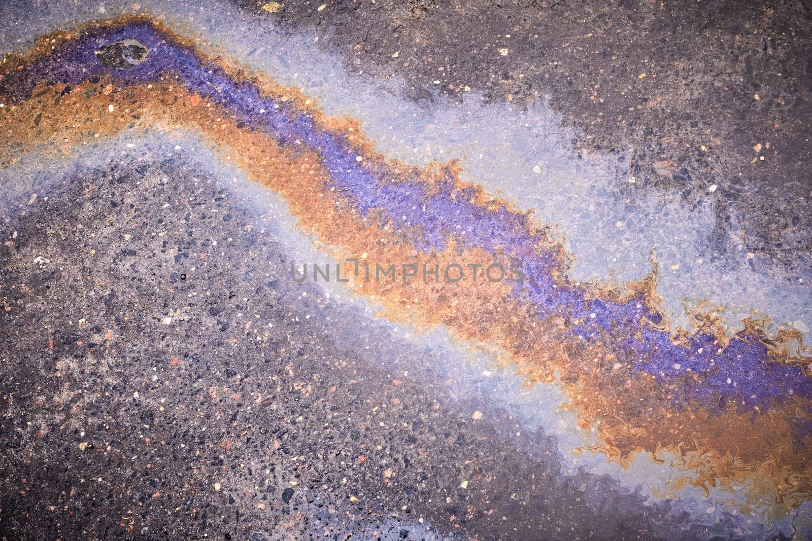 Puddle gasoline background, wet oil multicolored rainbow pollution spill by AliaksandrFilimonau