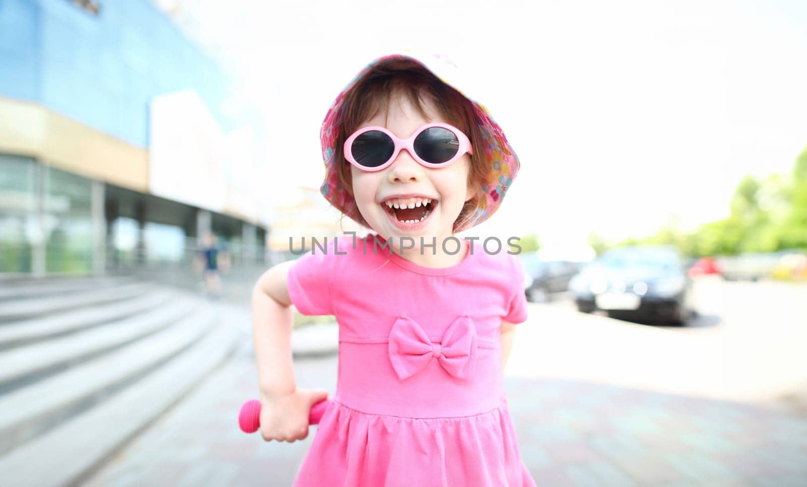 Happy smiling girl child in sunglasses outdoor portrait by kuprevich