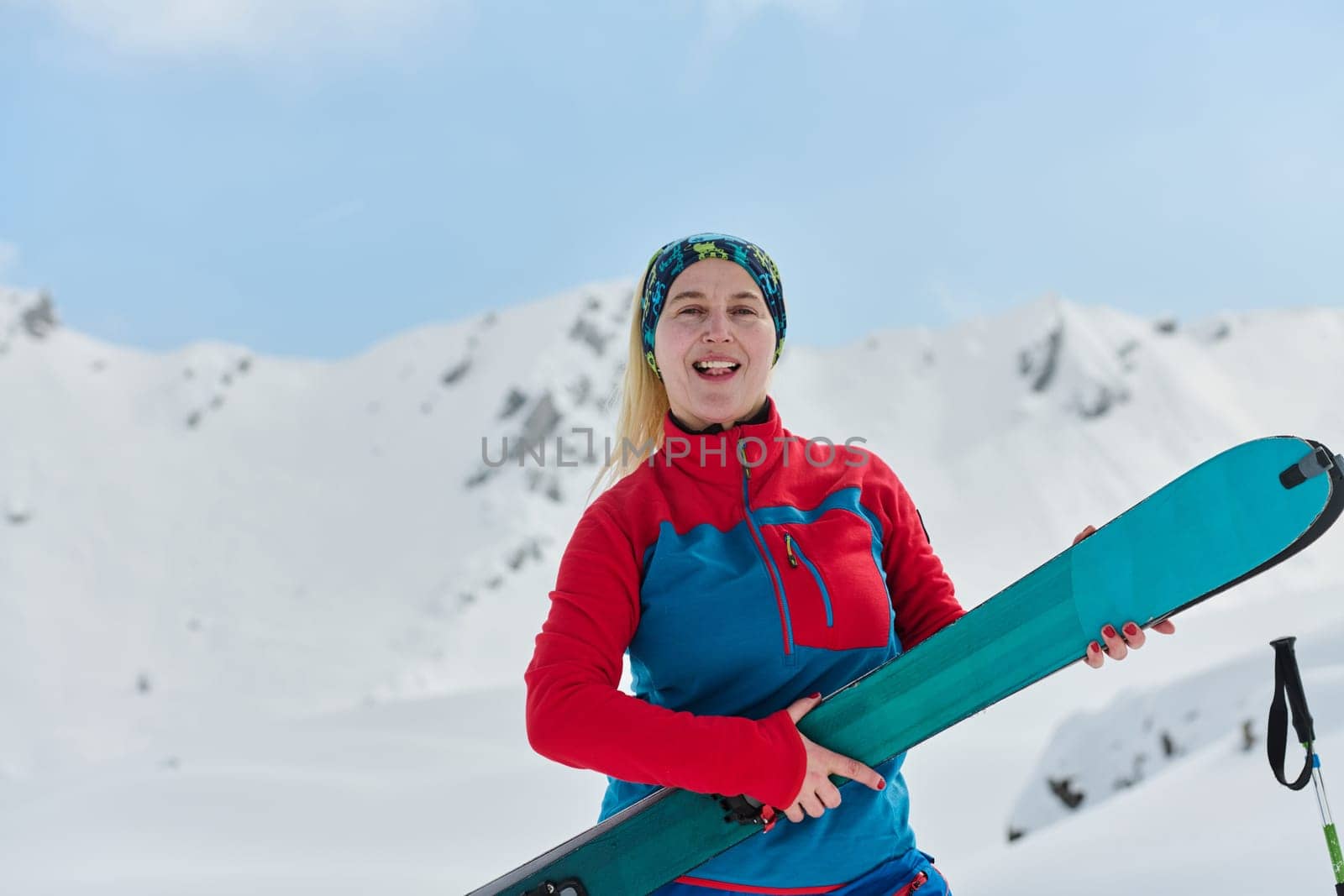 Conquering the Peak: Confident Skier Celebrates Success by dotshock