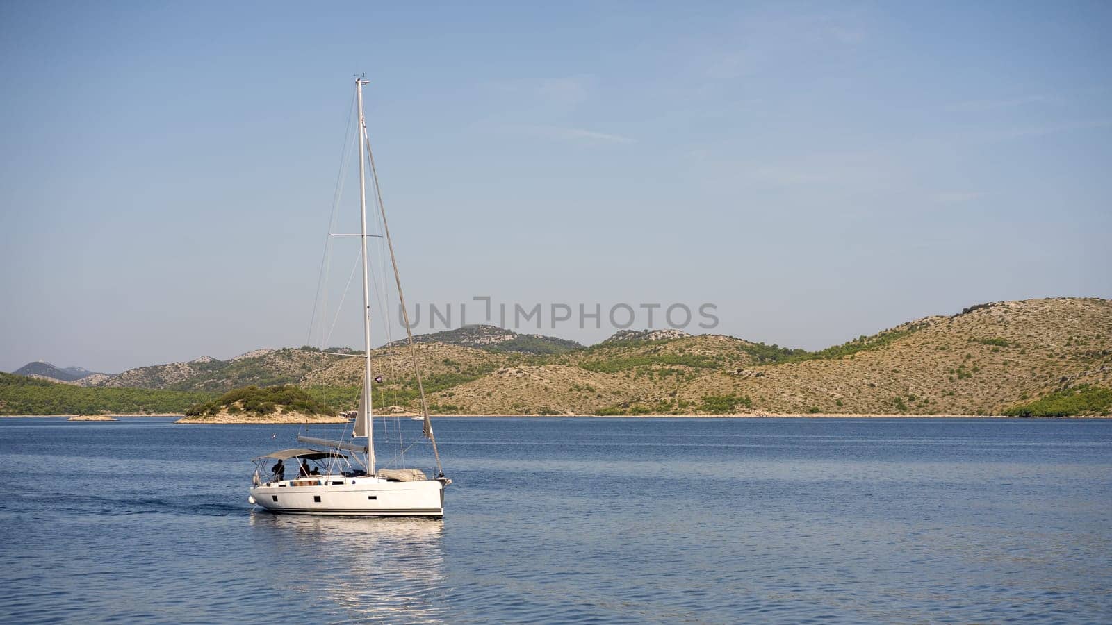 Coastal seaside scenic landscape of Dugi Otok island, luxury floating yacht in Adriatic Sea, Croatia