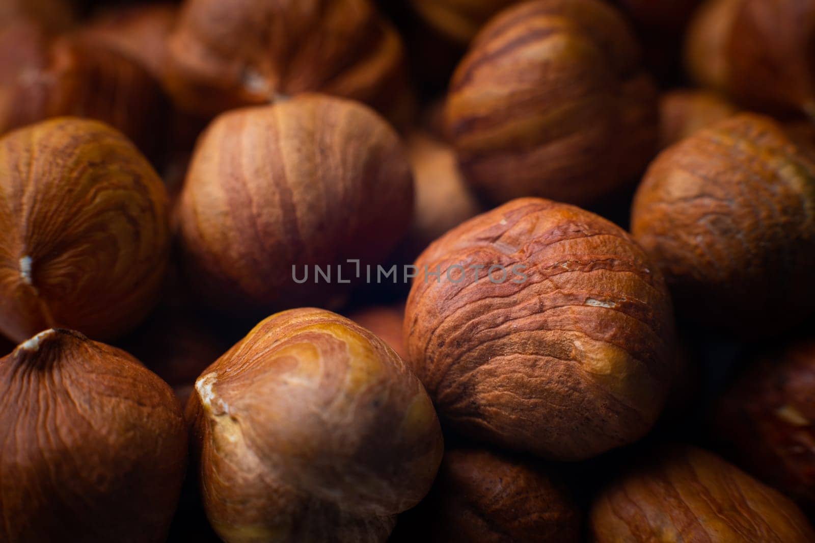 hazelnut kernels close-up. macro shot of the texture of a pile of nuts.