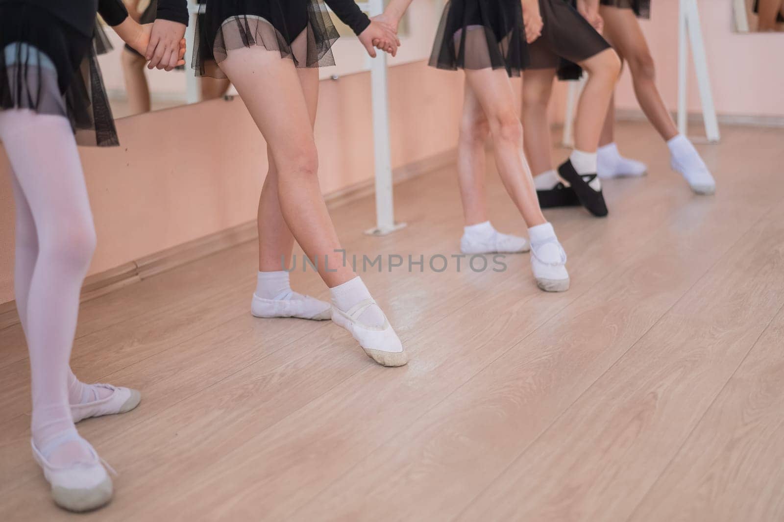Close-up of five little girls' feet and ballet class