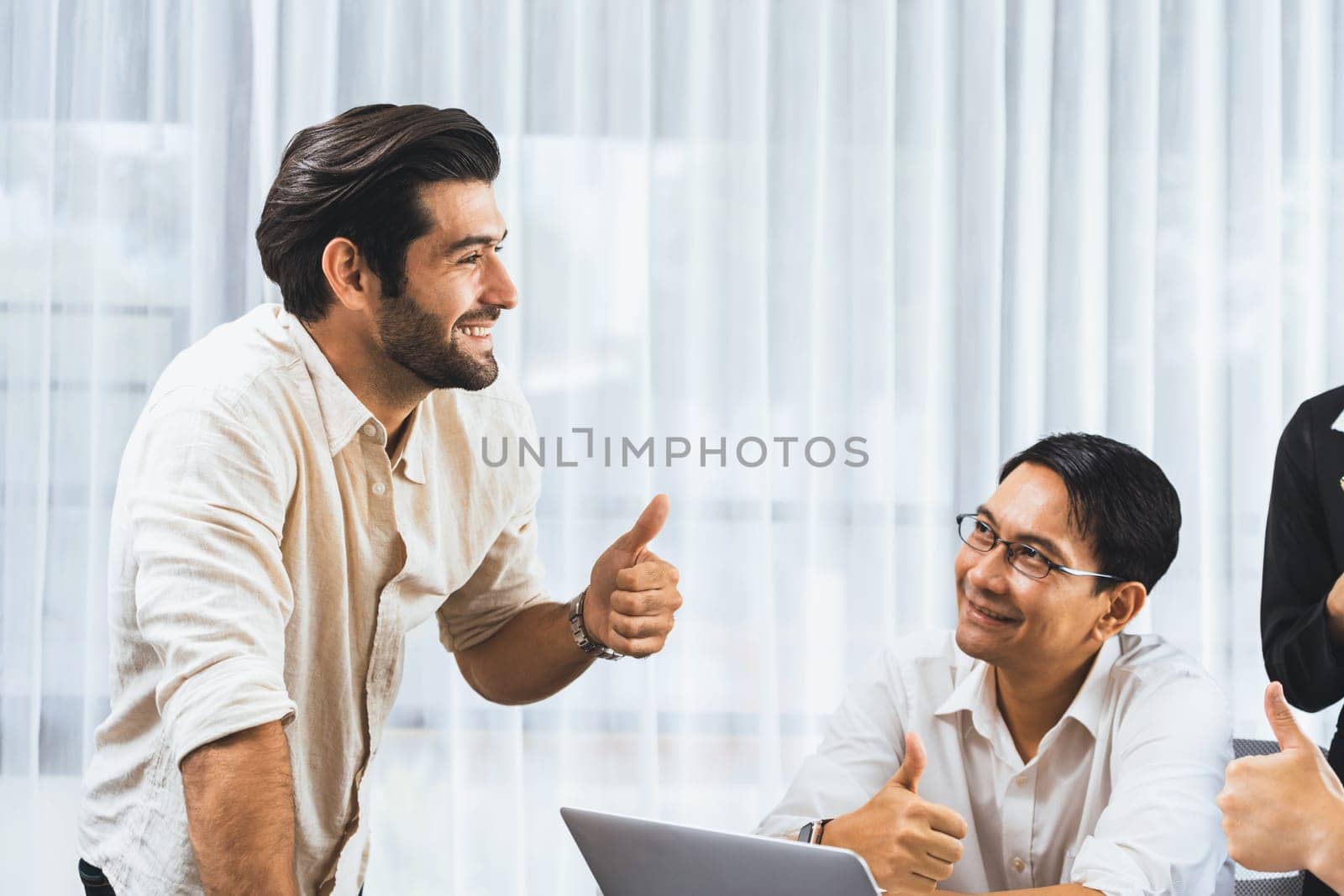 Excited and happy office worker employee celebrate after make successful strategic business marketing planning. Teamwork and positive attitude create productive and supportive workplace. Prudent