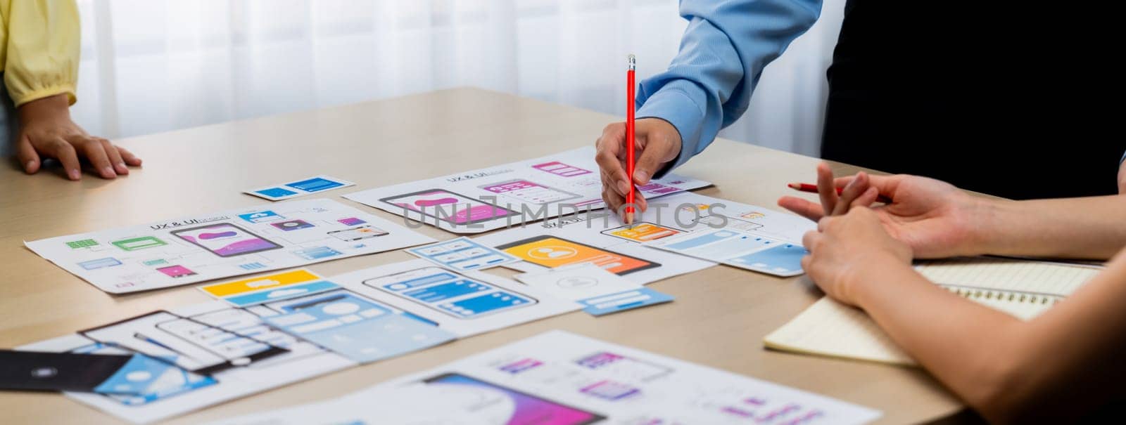 Panorama banner of startup company employee planning on user interface prototype for mobile application or website in office. UX UI designer brainstorm user friendly interface plan. Synergic