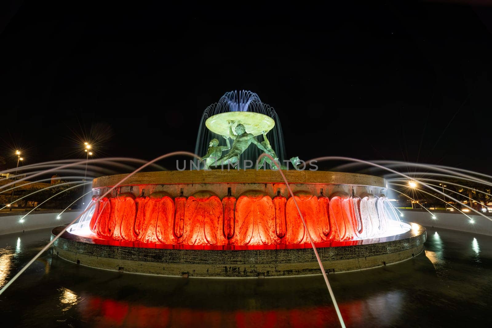 Valletta, Malta, April 03, 2024. the fountain of the tritons in the historic center of the city at night