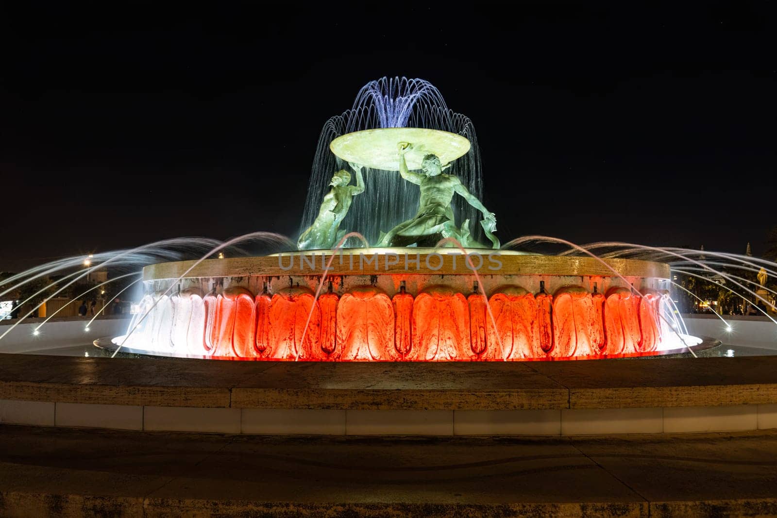 Valletta, Malta, April 03, 2024. the fountain of the tritons in the historic center of the city at night