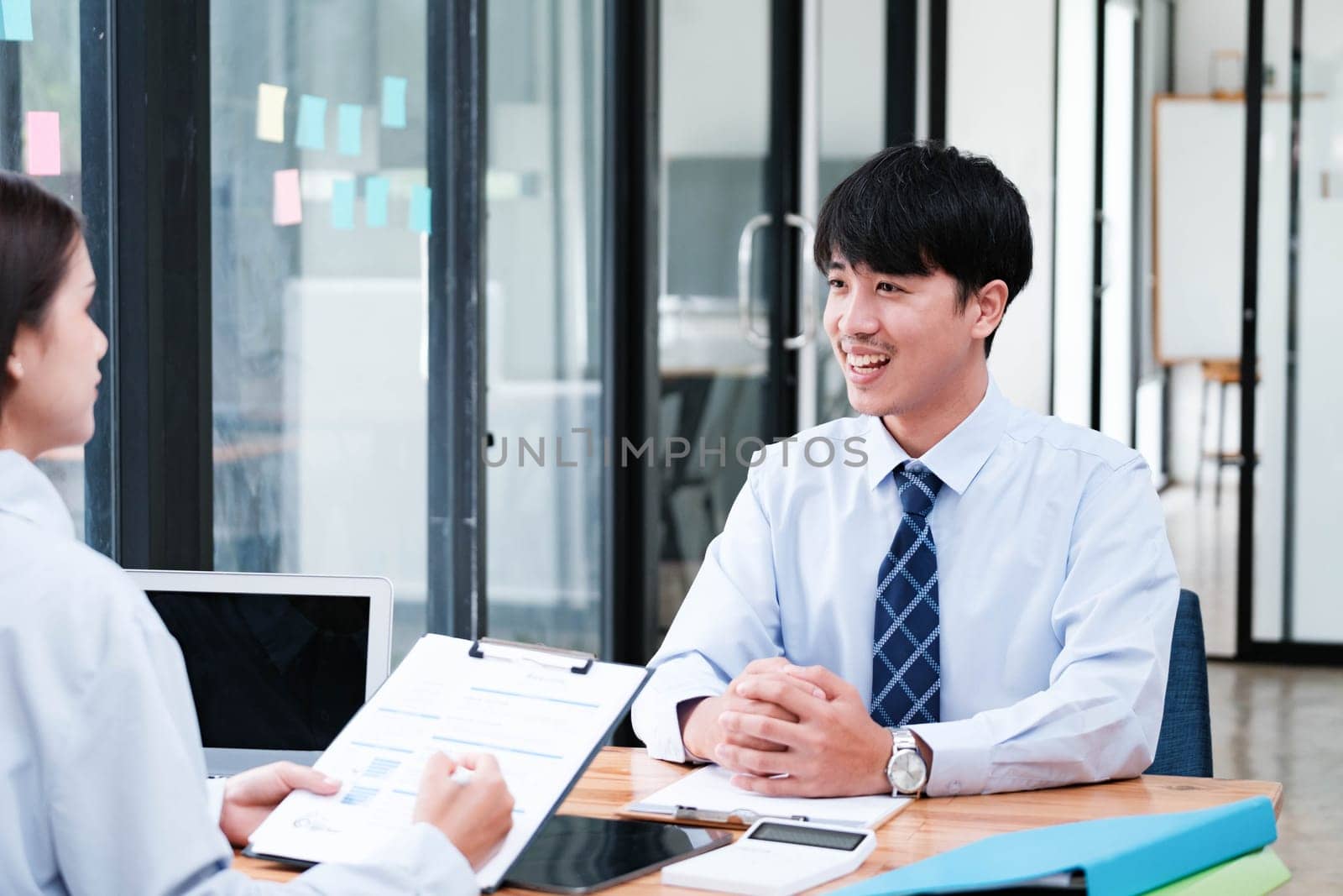 A candidate engaged in a job interview with a hiring manager, discussing qualifications and employment opportunities.