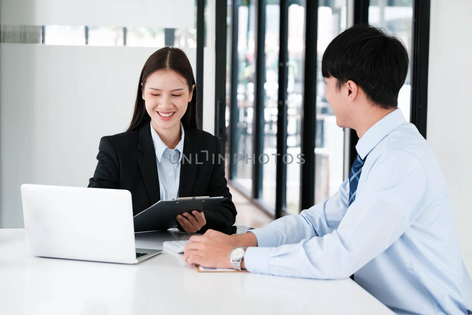 A candidate engaged in a job interview with a hiring manager, discussing qualifications and employment opportunities.