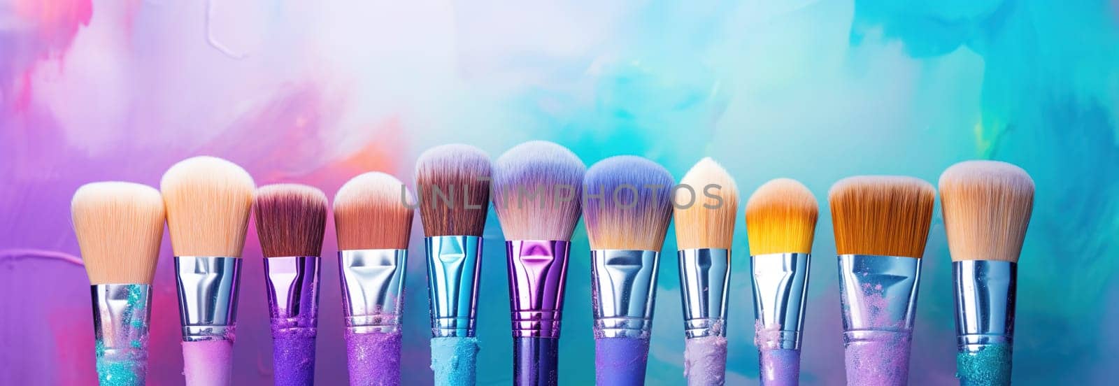 row of brushes laid out flat on a canvas, various shades of purple and blue against a colorful background by KaterinaDalemans